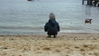 Little boy feeding ducks