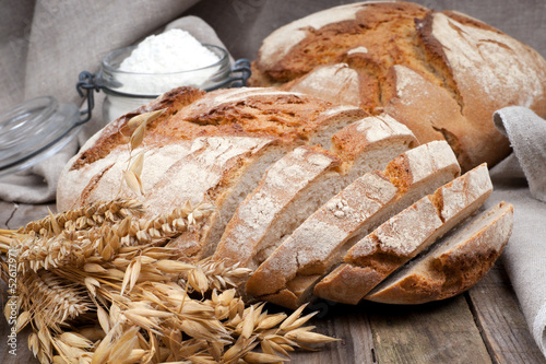 Photo: Fresh bread on wooden ground Fresh bread on wooden ground