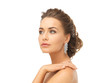 woman wearing shiny diamond earrings