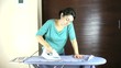 furious woman using the iron