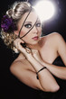 Portrait of beautiful naked girls sheltered in soft black materi