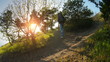 The girl tourist with backpack is traveling in the mountains