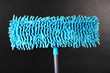 Blue mop for floor on gray background