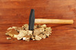 Golden nuggets with hummer on wooden background