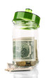 Glass jar with money isolated on white