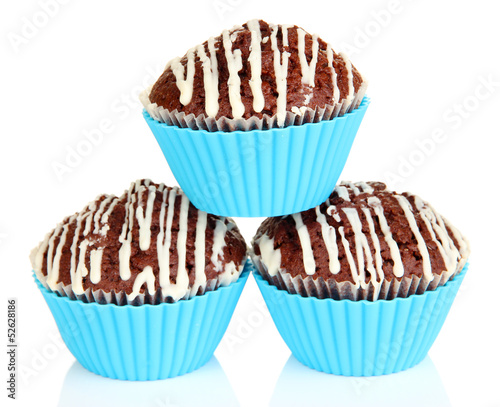 Photo: Sweet cupcakes isolated on white Sweet cupcakes isolated on white