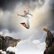Young businesswoman jumping