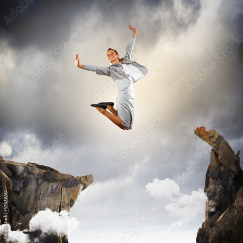 Photo: Young businesswoman jumping Young businesswoman jumping