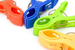 colorful clothespins on white with copy space