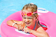 Children sitting on inflatable ring.