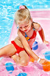 Child on water slide at aquapark.