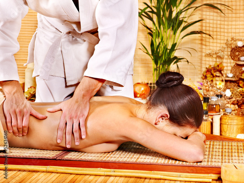 Photo: Woman getting bamboo massage. Woman getting bamboo massage.
