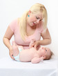Photo: Young mother with her baby. Young mother with her baby.