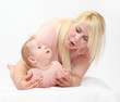 Photo: Young mother with her baby together. Young mother with her baby together.