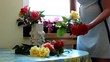 Women arranging flowers in vase