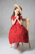 Child on a chair in a nice dress