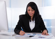 Businesswoman Working On Paper