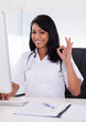 Happy Female Doctor Gesturing Ok Sign