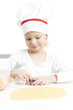 Photo: little girl cutting cookies little girl cutting cookies