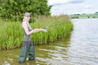 woman fishing in pond