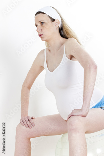 Photo: portrait of pregnant woman doing exercises portrait of pregnant woman doing exercises