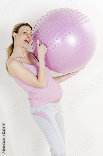 Photo: portrait of pregnant woman doing exercises with a ball portrait of pregnant woman doing exercises with a ball