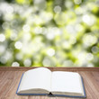 Open book on wooden planks
