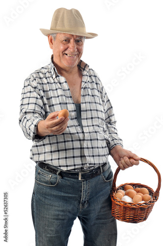 Photo: farmer man holds a basket with eggs farmer man holds a basket with eggs