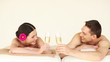 happy couple relaxing in spa salon
