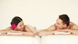 happy couple relaxing in spa salon