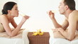 happy couple relaxing in spa salon