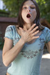 young woman suffocating or having allergies