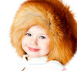 Photo: cheerful girl in a fur hat cheerful girl in a fur hat