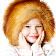 Photo: cheerful girl in a fur hat cheerful girl in a fur hat