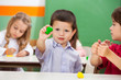 Boy Showing Clay At Classroom