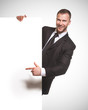 Photo: businessman holding blank billboard businessman holding blank billboard