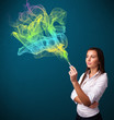 Photo: Pretty lady smoking cigarette with colorful smoke Pretty lady smoking cigarette with colorful smoke