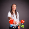 Young woman throwing dices and chips