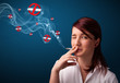 Young woman smoking dangerous cigarette with no smoking signs