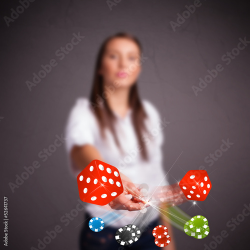 Photo: Young woman throwing dices and chips Young woman throwing dices and chips
