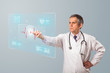 Middle aged doctor pressing modern medical type of button
