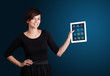 woman holding modern tablet with colorful icons