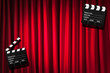 Movie clapper board against curtain