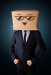 Businessman gesturing with a cardboard box on his head with smil