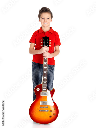 Photo: Portrait of young boy with a electric guitar Portrait of young boy with a electric guitar
