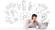 Young businessman brainstorming with drawn arrows and symbols