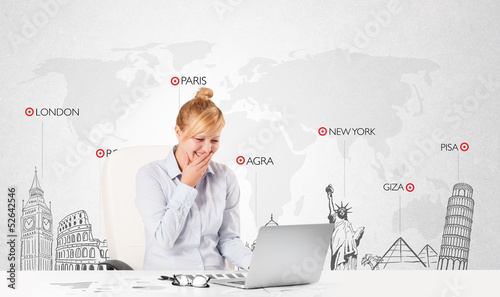 Photo: Beautiful businesswoman with world map and major landmarks of th Beautiful businesswoman with world map and major landmarks of th
