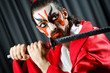 Man with sword and face mask