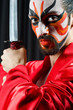 Man with sword and face mask