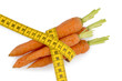 fresh carrots with tape measure